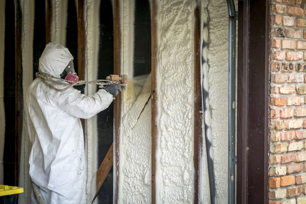 worker spraying open cell spray foam - The Advantages of Choosing Open Cell Spray Foam for Your Home